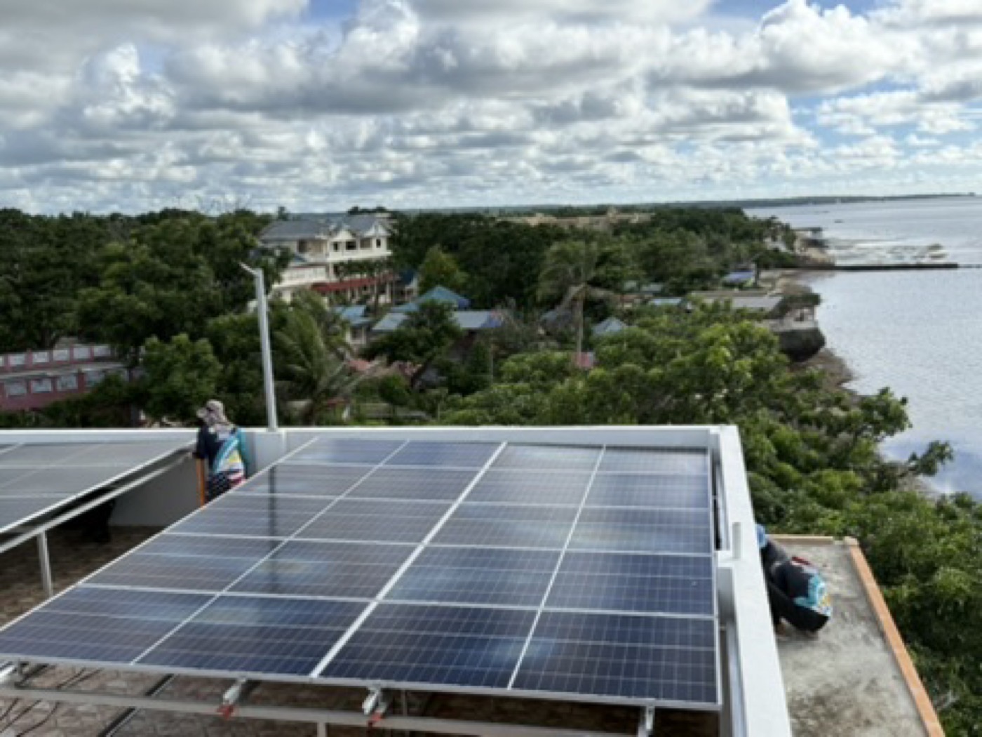 Solar panels installed on a coastal rooftop, exposed to salt air over many years