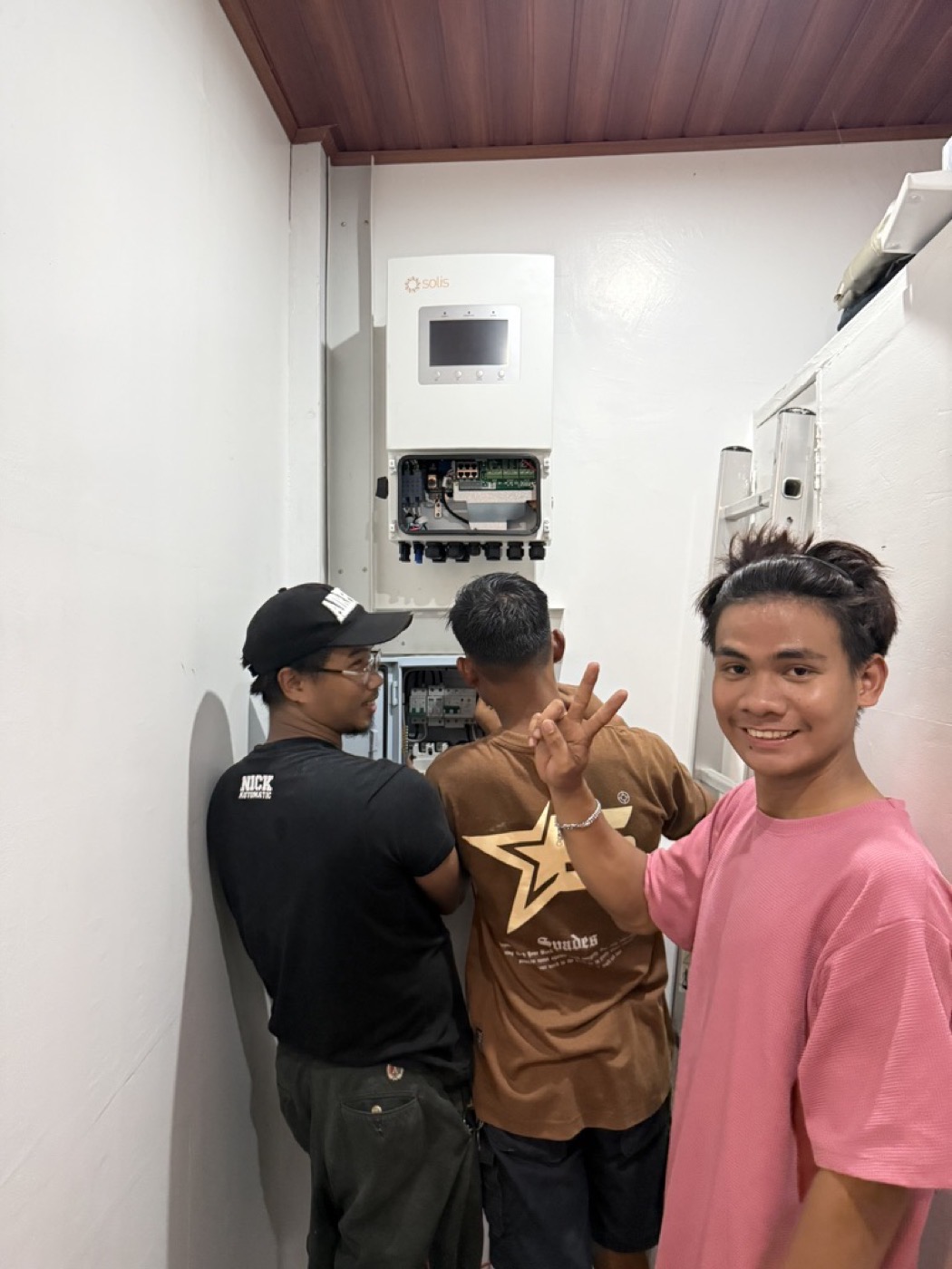 Bolinao Solar installers at a completed inverter installation during handover